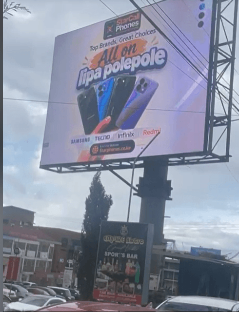 A StarCall Phones billboard in Nairobi advertising Samsung, Tecno, Infinix, and Redmi phones on a 'Lipa Pole Pole' (pay slowly) plan.